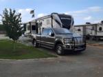 Parked trailer near pickup truck at Aviator RV Park - thumbnail