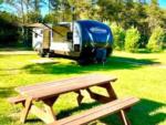 Parked trailer at site Plum Pines RV Park & Campground - thumbnail