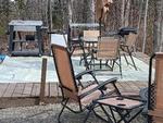 Patio with Bbq and seating area at Mystic Valley Campground - thumbnail
