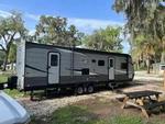 Parked trailer at site Shell Harbour RV Resort - thumbnail