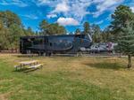 Parked trailer's at site Elk Run RV Park and Cabins - thumbnail