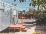 RV and table and chairs on gravel - thumbnail