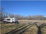 A travel trailer parked at a site - thumbnail