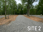 Site 2 with trees at Huckleberry Hideaway Cabins & RV Resort - thumbnail