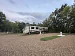 Class A motorhome parked at site - thumbnail