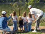 A young family looking out over the lake - thumbnail