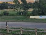 A view of the mountains beyond a rustic fence - thumbnail