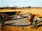 Group of chairs around a fire pit - thumbnail