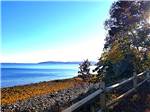 The ocean beyond a rustic fence - thumbnail
