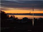 An orange sunset over the water - thumbnail