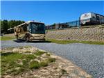 An RV with an awning at a site - thumbnail
