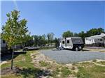 A small travel trailer at a site - thumbnail