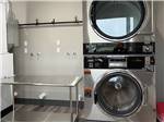 A flolding table and machines in the laundry room - thumbnail