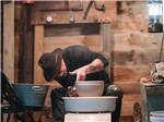 A man making a bowl on a pottery wheel - thumbnail
