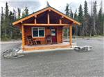 A rental cabin with a covered porch - thumbnail