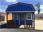 A little blue cabin with a porch - thumbnail