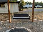 A fire pit and swinging bench - thumbnail