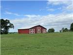 The barn surrounded by grass - thumbnail