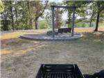 A grill near a bench swing - thumbnail