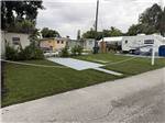 An RV parked in a paved site - thumbnail
