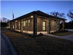 A brick building at night - thumbnail