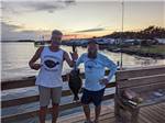 Men holding a fish they caught - thumbnail
