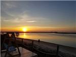 The sun sets over the water - thumbnail