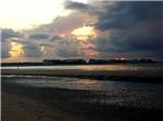 The sun sets behind clouds - thumbnail