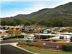 View larger image of Aerial view over RV park and green mountainside at PECHANGA RV RESORT image #7