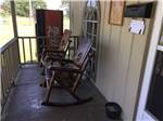 Porch with rocking chairs near front door of office at WEEKS ISLAND RV PARK - thumbnail