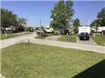Paved RV sites with grass at CAMPGROUNDS OF THE SOUTH - thumbnail