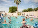 View larger image of People swimming in pool at CACTUS GARDENS RV RESORT image #4