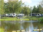 View larger image of The lake in front of some RV sites at CAMPING MELBOURNE ESTRIE image #1