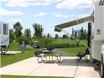 View larger image of One of the paved RV spaces with a picnic bench at DEER PARK RV RESORT image #2