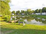 View larger image of Trailers camping on the lake at LITTLE FARM ON THE RIVER RV PARK CAMPING RESORT image #2
