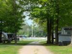 A view of the pool from a tree-lined road at Twin Ells Campsite - thumbnail