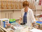 View larger image of A woman in the arts and craft room at TROPIC STAR RV RESORT image #4