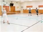 View larger image of A group of people playing pickleball at TROPIC STAR RV RESORT image #9