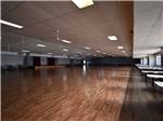 View larger image of A large wooden floor in the recreation hall at TROPIC STAR RV RESORT image #12