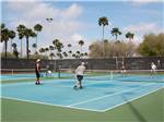 View larger image of A couple of men playing pickleball at TIP O TEXAS RV RESORT image #9