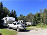 A row of travel trailers parked in RV sites at CAMPING CABANO, ENR.205310 - thumbnail