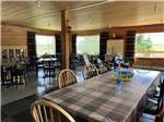 A long table and chairs in the rec room at CAMPING CABANO, ENR.205310 - thumbnail