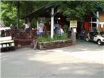 Guest enjoying food under the pavilion at FORT WILDERNESS CAMPGROUND AND RV PARK - thumbnail