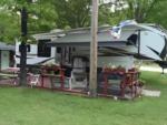 Parked trailer with covered patio at Indian Lake RV Resort - thumbnail