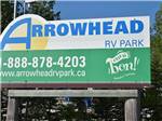 Entrance sign with website and phone number at ARROWHEAD RV PARK - thumbnail