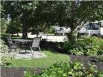 Outdoor seating area with table at ARROWHEAD RV PARK - thumbnail
