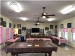 View larger image of Hall with long dining tables and pool table at LAKE CITY RV RESORT image #11