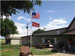 View larger image of USA and Good Sam flags flying at office at TRAVELERS WORLD RV PARK image #2