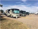 View larger image of Big rigs parked on gravel sites at TRAVELERS WORLD RV PARK image #5