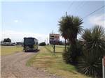 View larger image of RV driving by sign at the park entrance at TRAVELERS WORLD RV PARK image #6